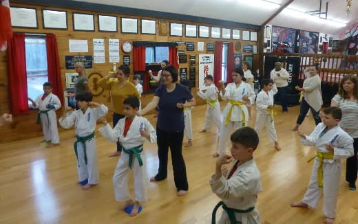 a person teaching children in a class