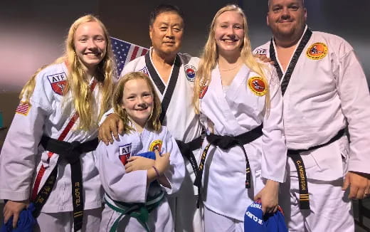 a group of people wearing medals