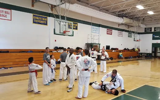 a group of people in karate uniforms
