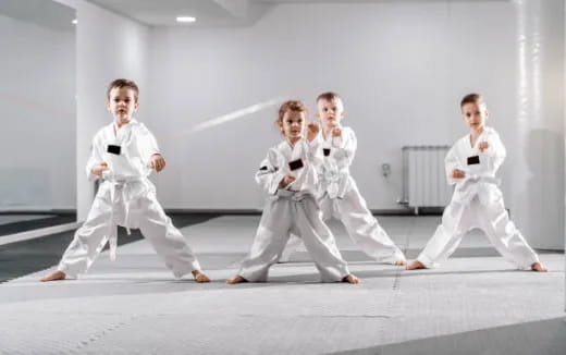 a group of people in karate uniforms