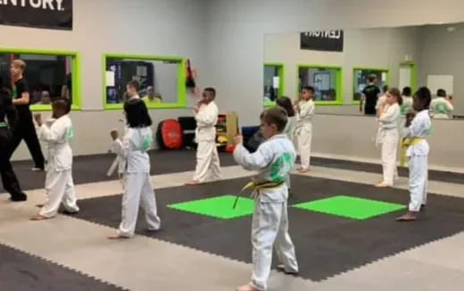 a group of people in karate uniforms