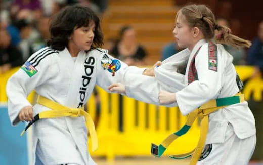 women in white uniforms holding hands