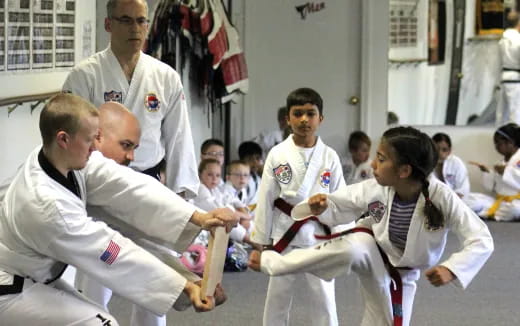 a group of people in karate uniforms
