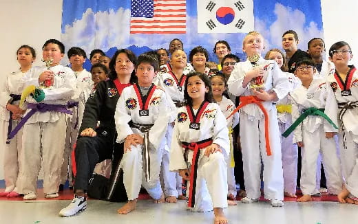 a group of people in karate uniforms