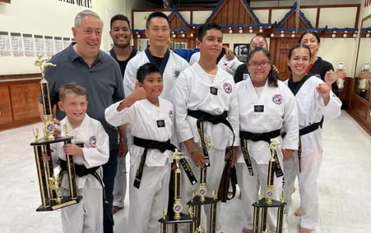 a group of people in karate uniforms