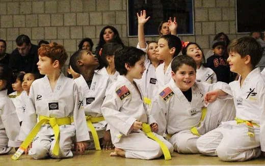 a group of people in karate uniforms
