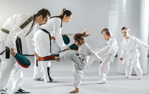 a group of people in karate uniforms