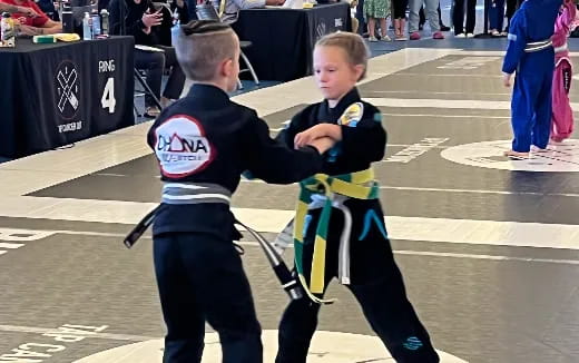 a person holding a boy in a garment