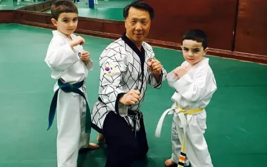 a group of boys in karate uniforms