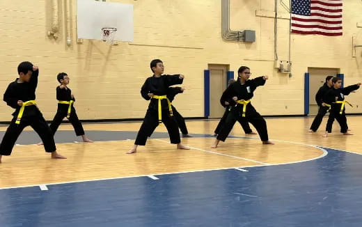 a group of people in black uniforms
