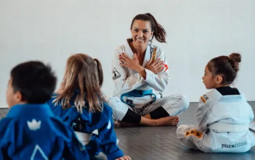 a person sitting with a group of children