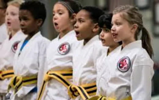 a group of people in white uniforms