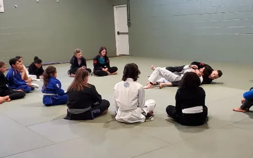 a group of people sitting on the floor