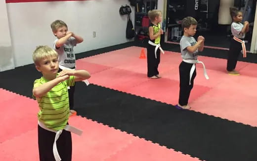 a group of children playing on a red carpet