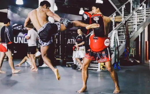 a group of men in a wrestling ring