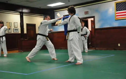 a group of people in karate uniforms