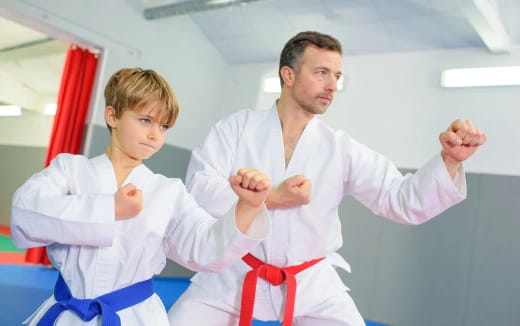 a man and a boy in karate uniforms