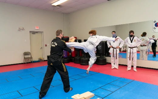 a group of people in karate uniforms