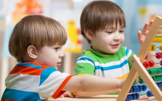 a couple of boys playing with toys