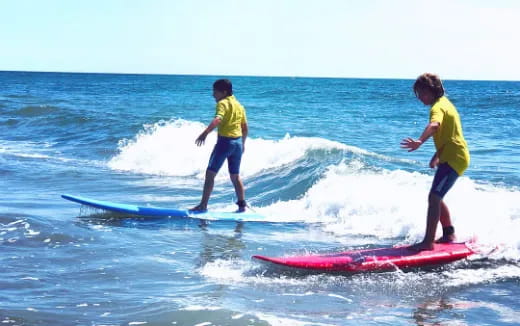 kids on surfboards in ocean