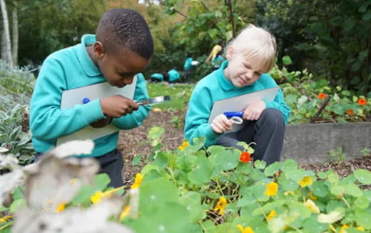 a person and a boy looking at a cell phone