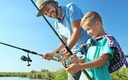 a person and a boy fishing