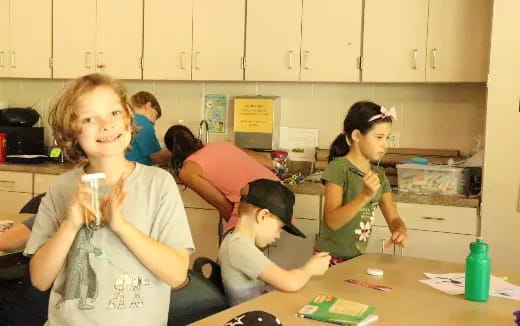 a group of people in a kitchen