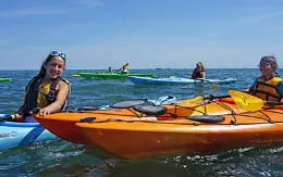 a group of people in kayaks