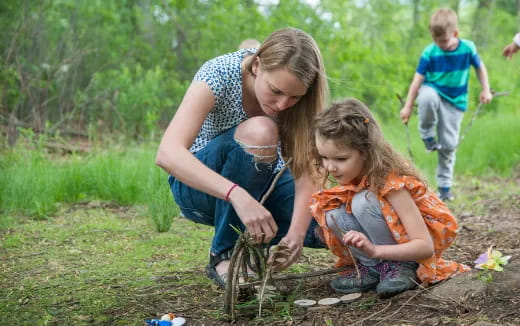 a person and a child playing with a fire