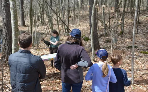 a group of people in the woods
