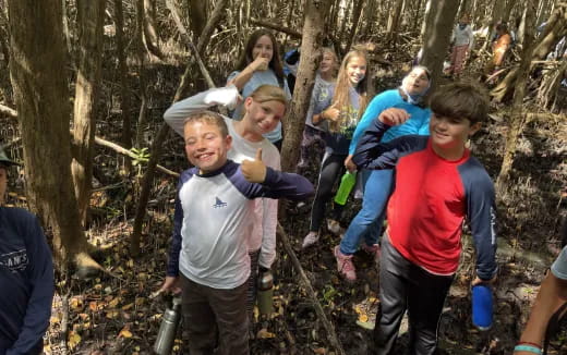 a group of people in the woods
