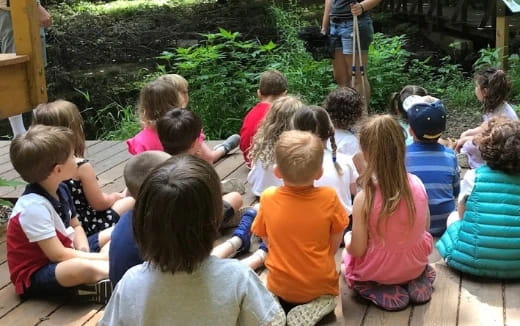 a group of children sitting on the ground