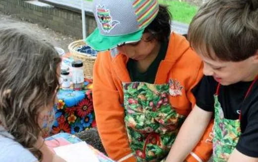 a group of children painting