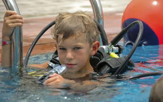 a boy in a pool