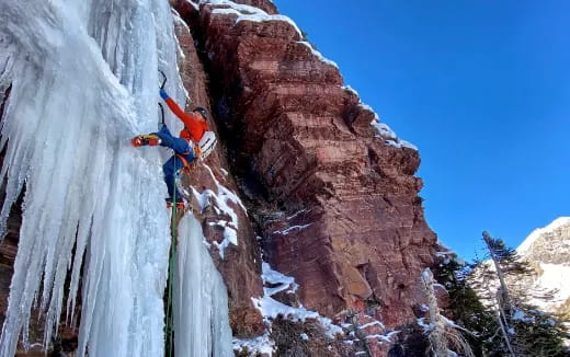 a person climbing a rock