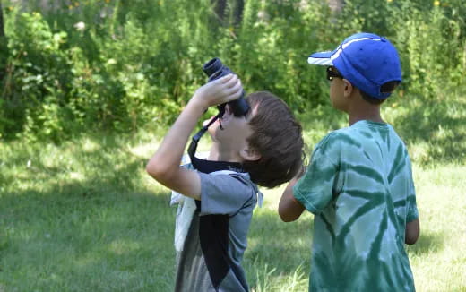 a couple of kids shooting bows