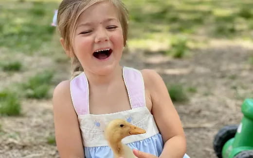 a child holding a toy