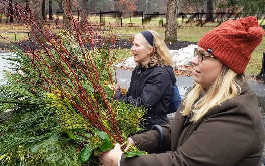 a couple of women in a garden