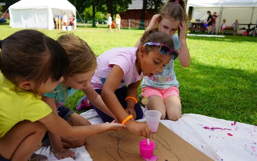 a group of children painting