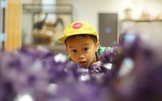 a doll wearing a yellow hat