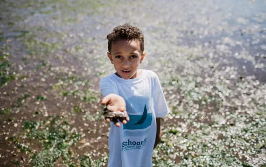 a boy holding a toy gun