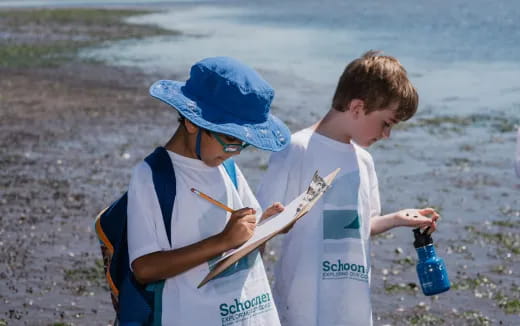 a person and a boy looking at a map