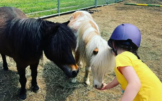 a couple of kids stand near each other