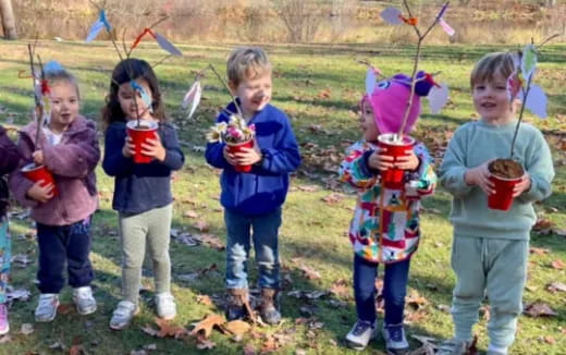 a group of children holding cups