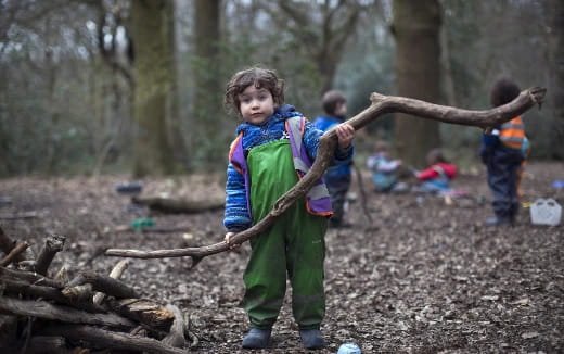 a girl holding a stick