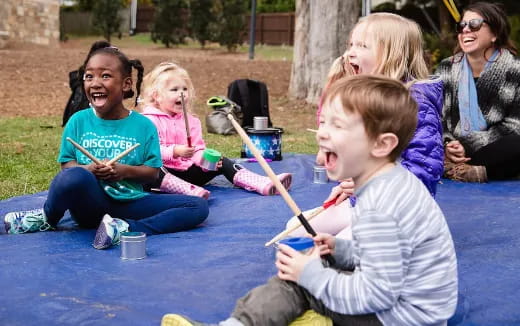 a group of people sitting on the ground