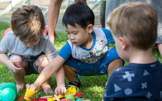 a group of children playing with toys