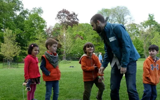 a person and a group of children
