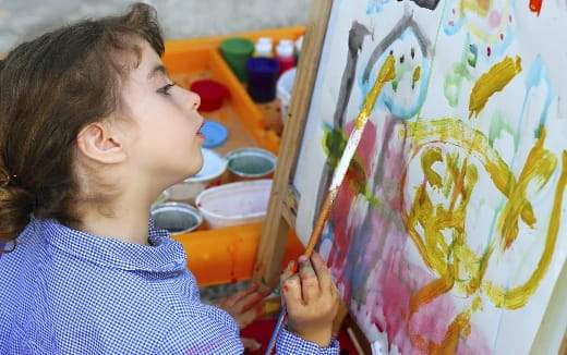 a young girl painting