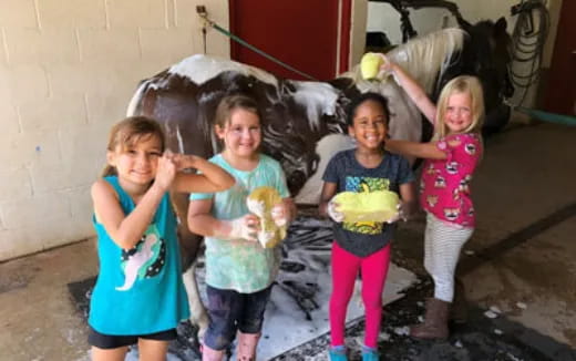 a group of children holding flowers
